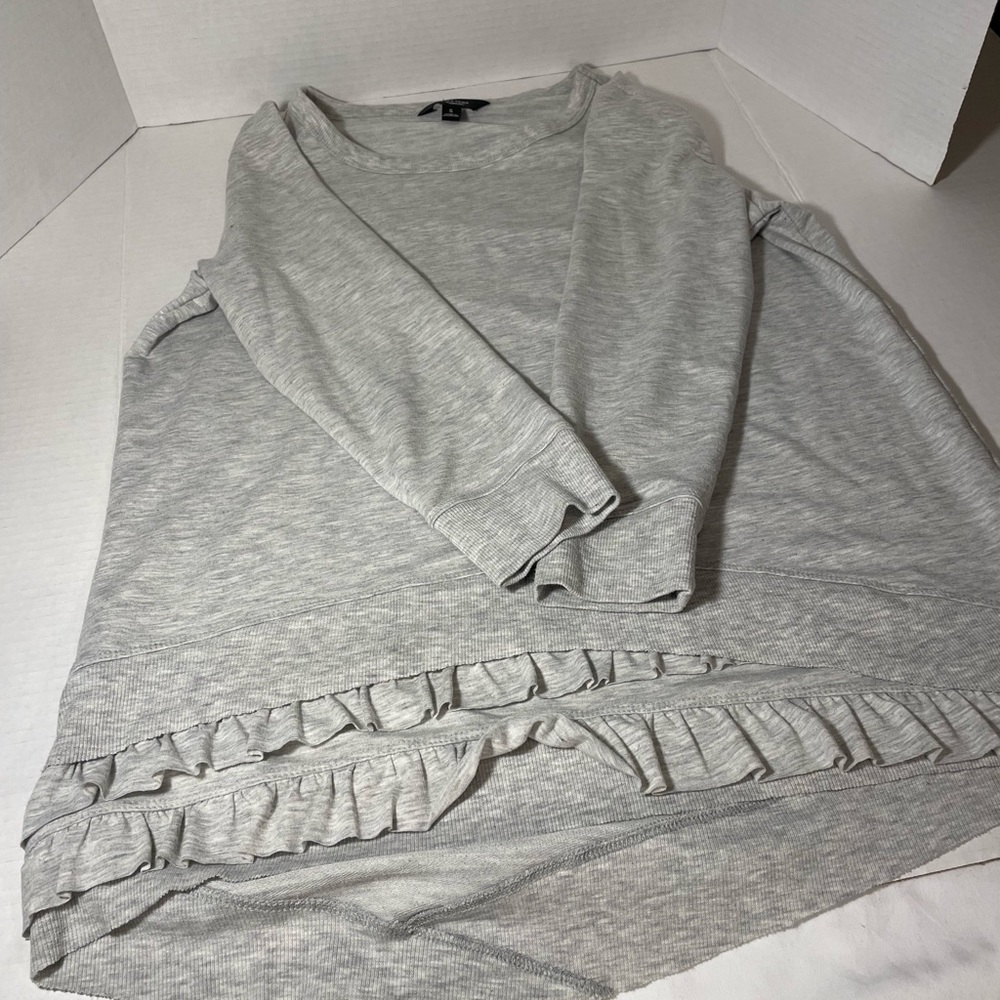 Camiseta manga largas con vuelos al final